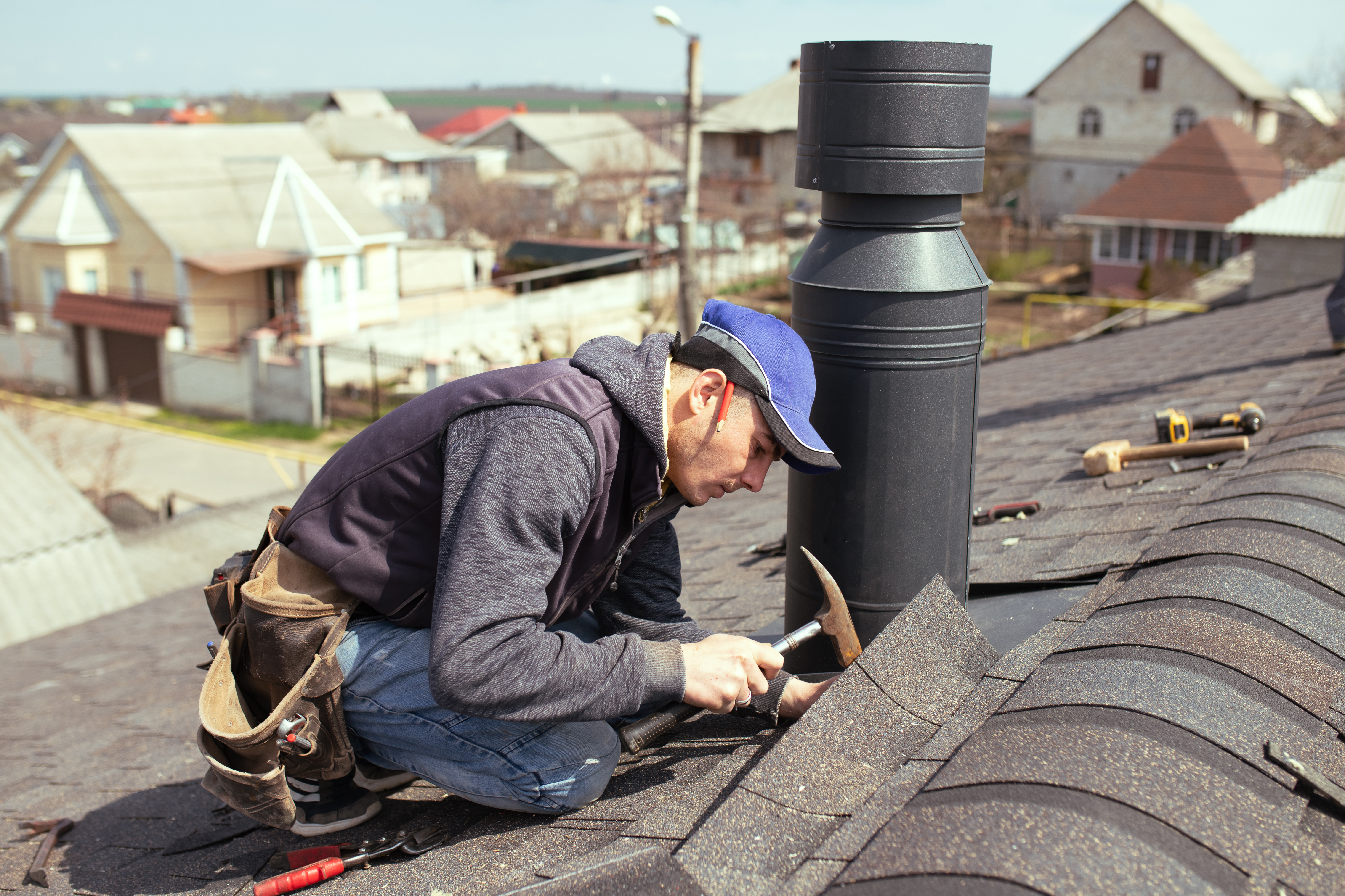 Master roofer inspecting a roof